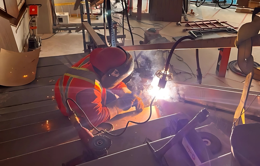 FCAW wear plate replacement welding for industrial equipment in Delta BC